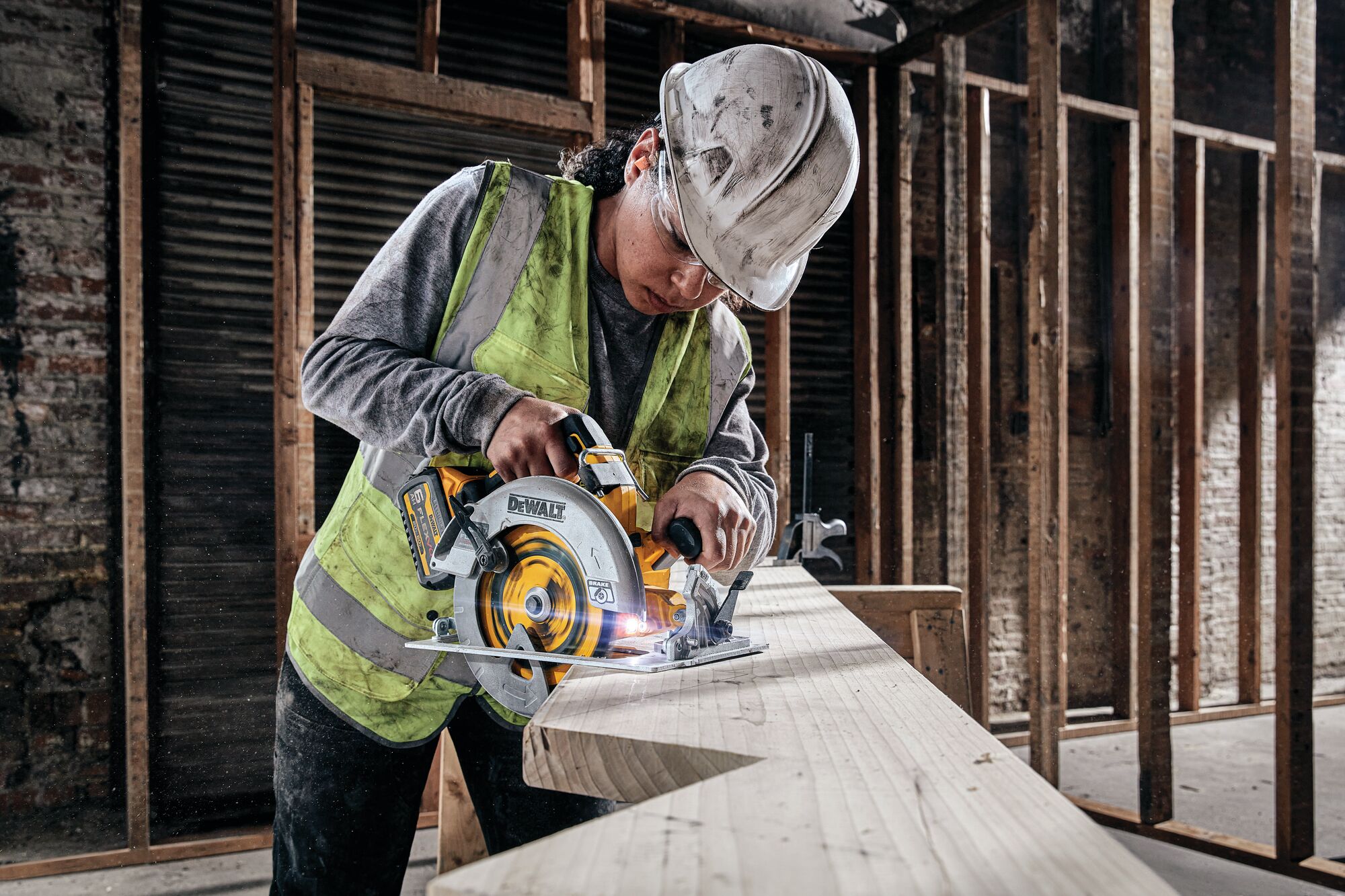 Brushless cordless circular saw with FLEXVOLT Advantage being used by person to cut wooden plank.
