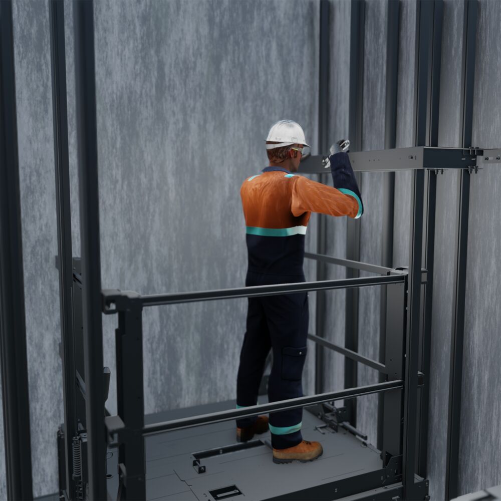 A contractor attaching an elevator